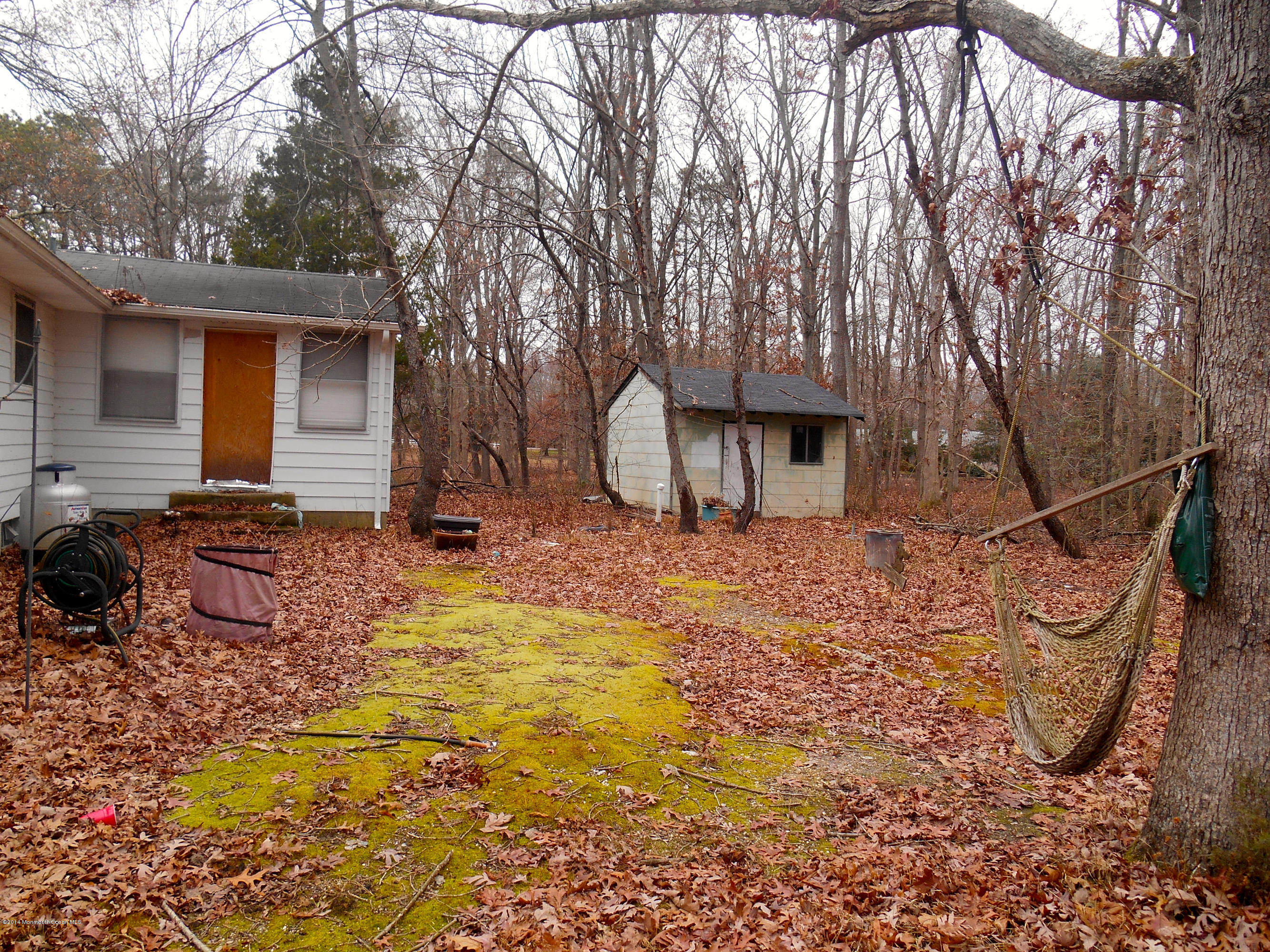 155 Pittenger Pond Road Freehold, NJ 07728 - Photo 11 of 13 FOUR SEASONS ROOM OFF BACK OF HOUSE
