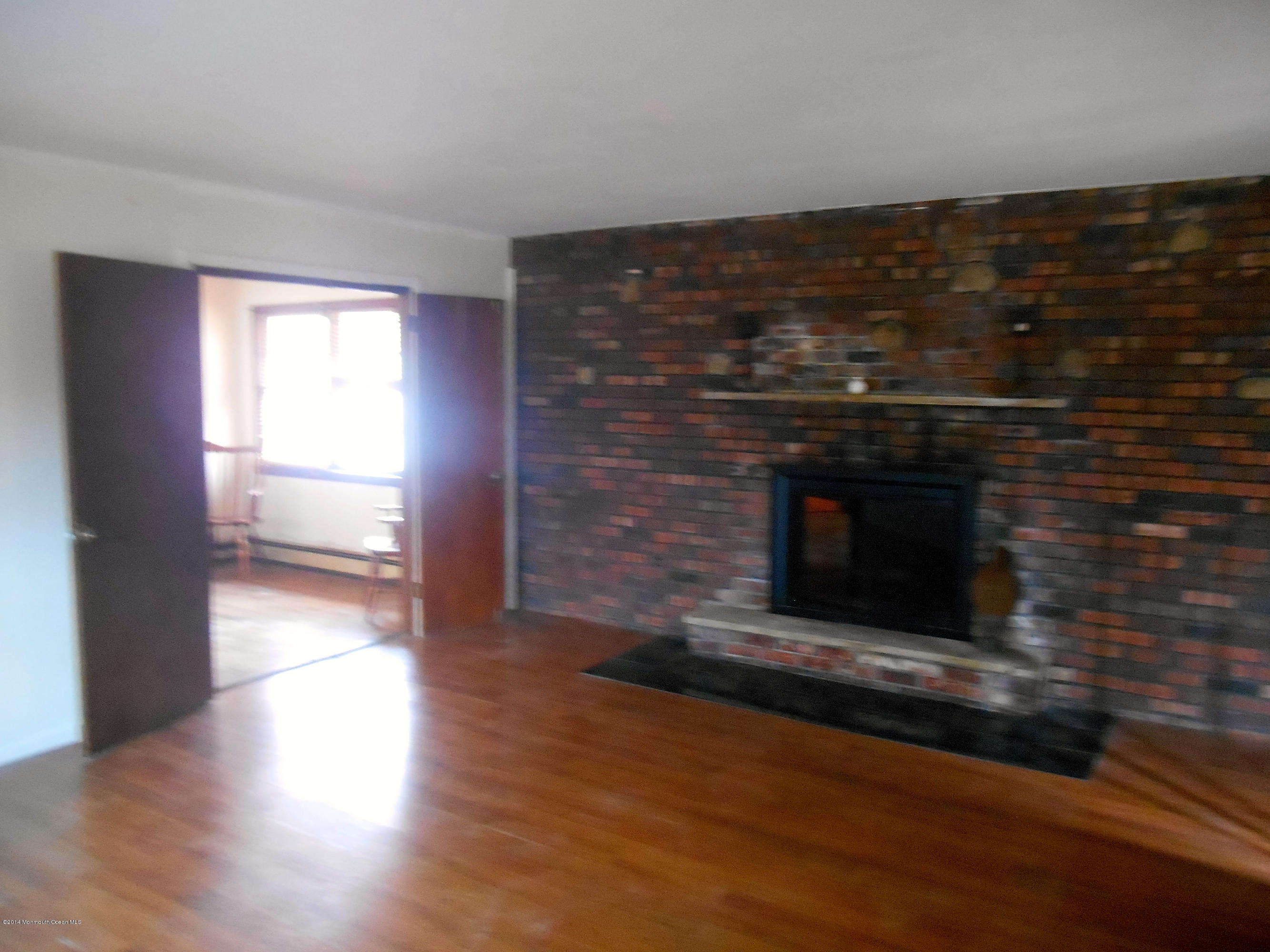 155 Pittenger Pond Road Freehold, NJ 07728 - Photo 3 of 13 FAMILY ROOM WITH FIREPLACE & WOOD FLOORS