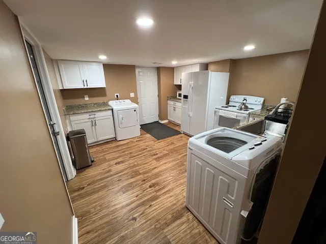 a kitchen with a sink stove and refrigerator