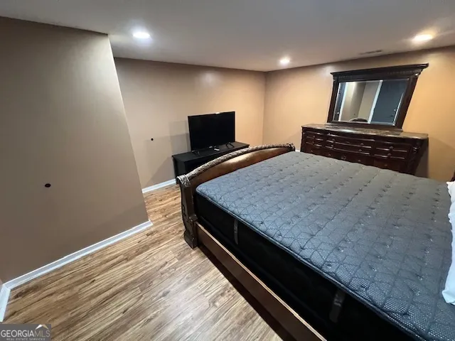 a bedroom with a bed and television