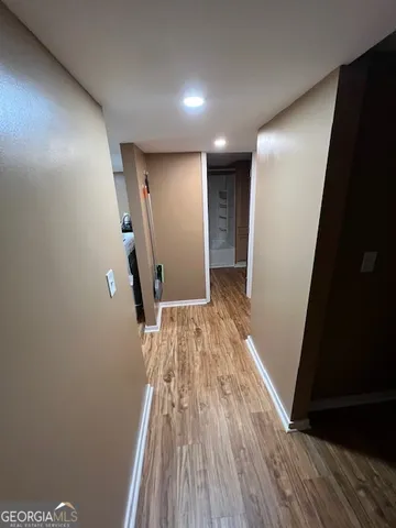 a view of entryway with wooden floor