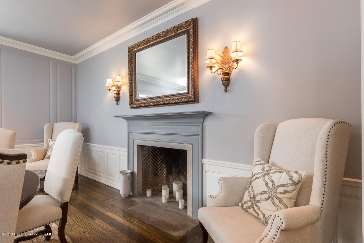 1590 Lombardy Road Pasadena, CA 91106 - Photo 18 of 85 a living room with furniture a fireplace and a potted plant