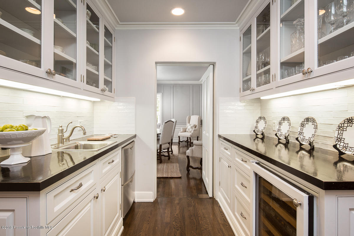 1590 Lombardy Road Pasadena, CA 91106 - Photo 19 of 85 a kitchen with a sink stove and cabinets