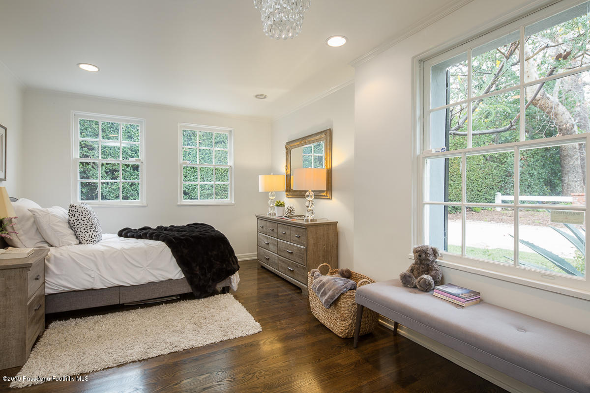 1590 Lombardy Road Pasadena, CA 91106 - Photo 31 of 85 a bedroom with a bed and wooden floor