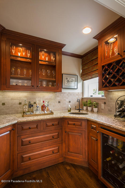1590 Lombardy Road Pasadena, CA 91106 - Photo 42 of 85 a kitchen with granite countertop a sink and cabinets