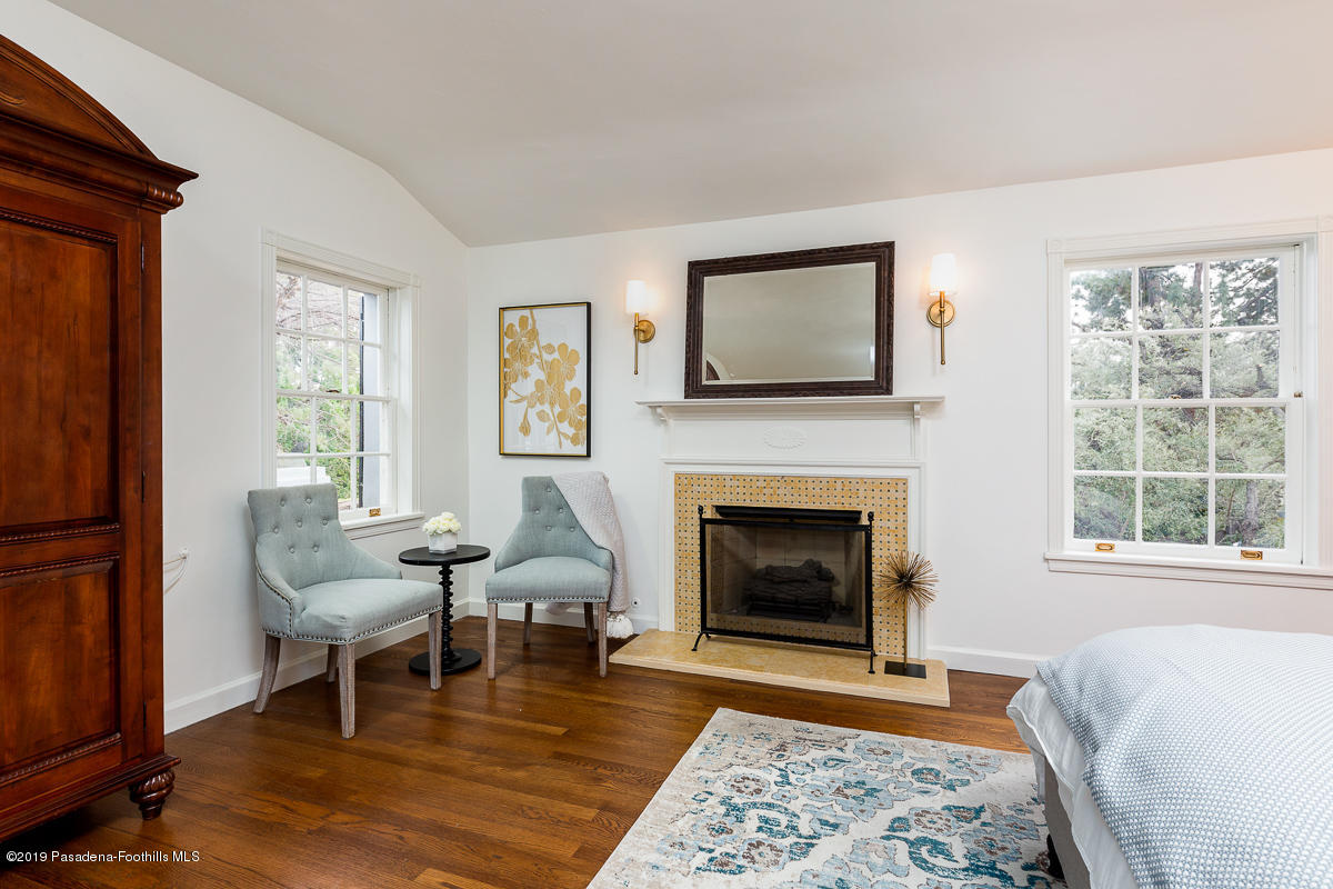 1590 Lombardy Road Pasadena, CA 91106 - Photo 52 of 85 a living room with furniture and a fireplace