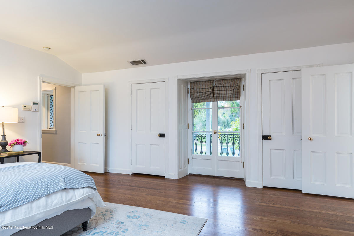 1590 Lombardy Road Pasadena, CA 91106 - Photo 53 of 85 a spacious bedroom with a bed and a window