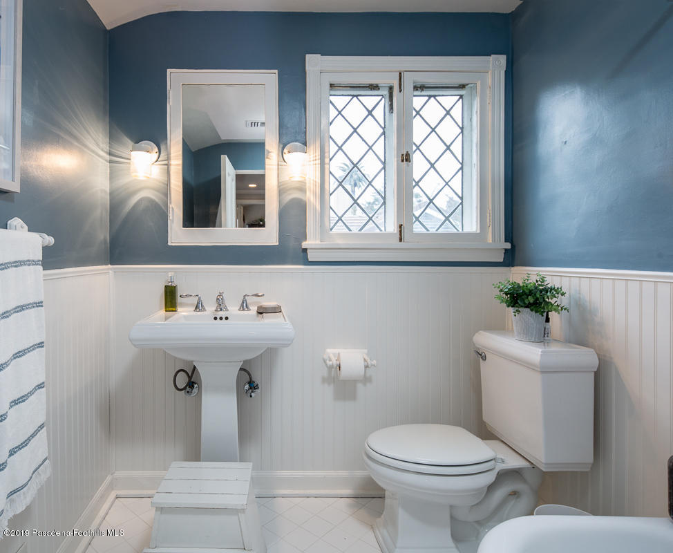 1590 Lombardy Road Pasadena, CA 91106 - Photo 59 of 85 a bathroom with a sink mirror toilet and next to a window