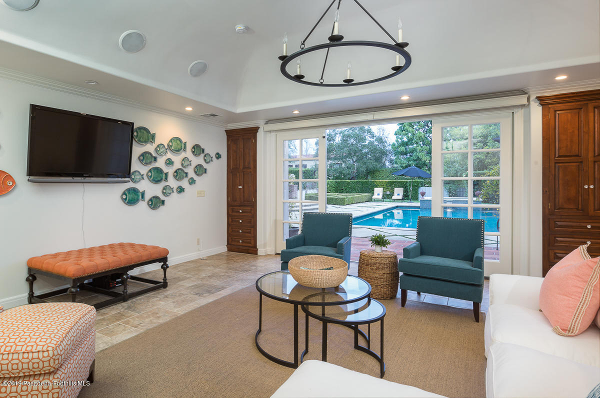 1590 Lombardy Road Pasadena, CA 91106 - Photo 70 of 85 a living room with furniture a flat screen tv and a large window