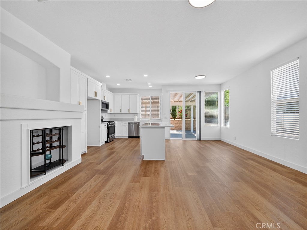1436 Riviera Avenue Banning, CA 92220 - Photo 11 of 43 a view of a living room a window and a fireplace