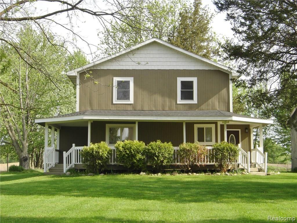 4378 Chase Lake Road Howell, MI 48855 - Photo 1 of 19 Beautiful, peaceful setting - relax on wrap-around porch