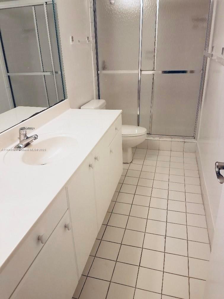6801 Southwest 147th Avenue, Unit 1E2 Miami, FL 33193 - Photo 11 of 15 a bathroom with a sink and a mirror