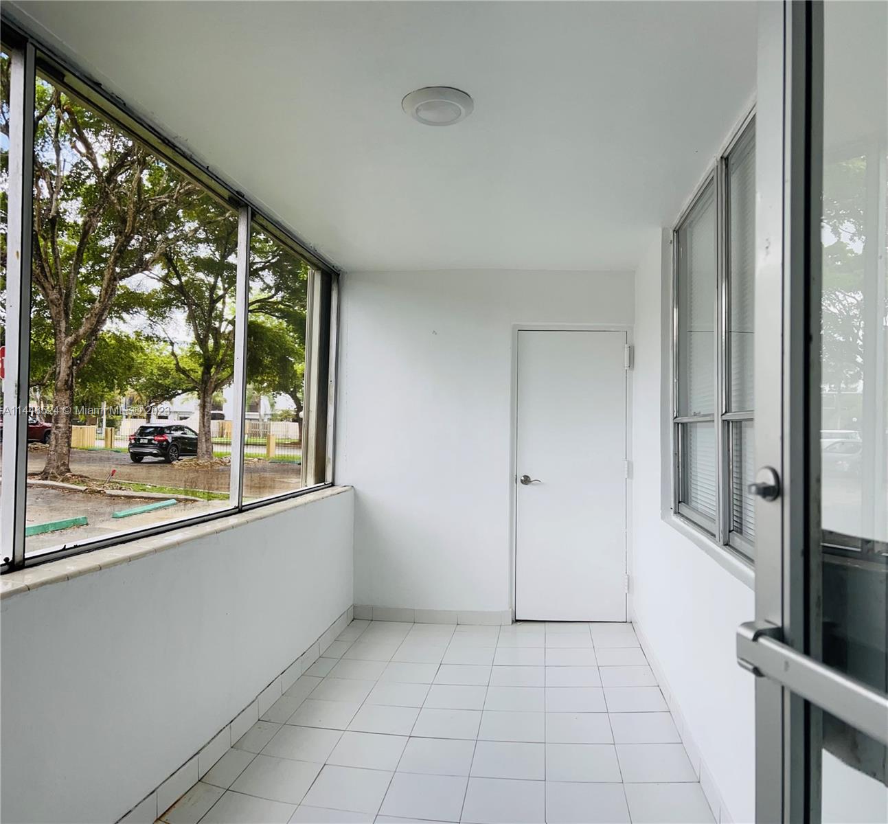 6801 Southwest 147th Avenue, Unit 1E2 Miami, FL 33193 - Photo 12 of 15 a view of a room with a large window