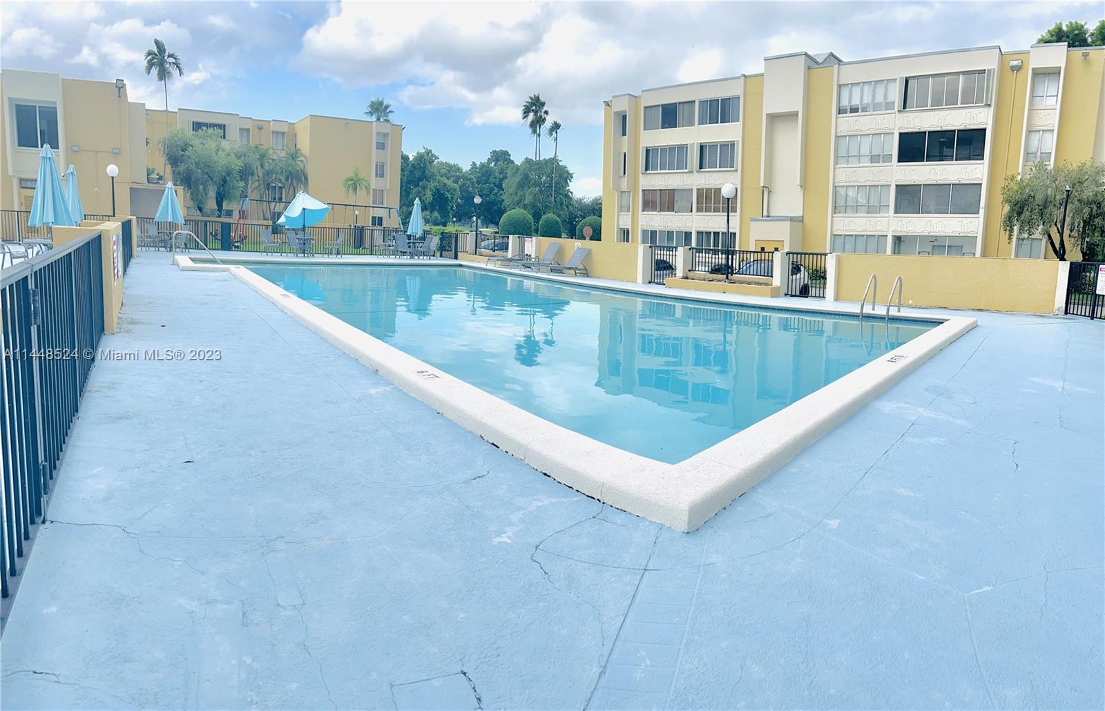 6801 Southwest 147th Avenue, Unit 1E2 Miami, FL 33193 - Photo 14 of 15 a view of a swimming pool and a porch