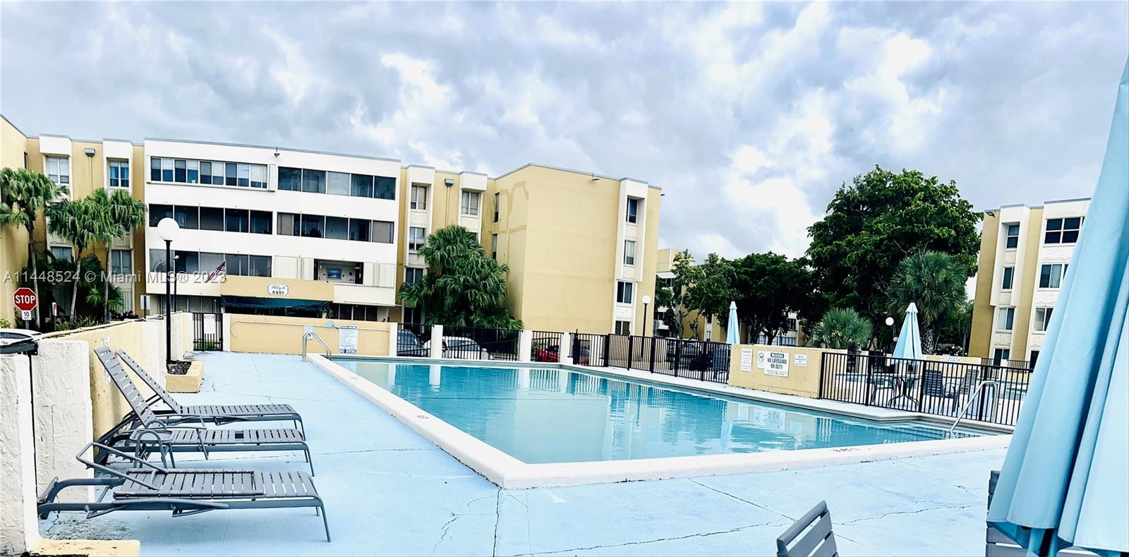 6801 Southwest 147th Avenue, Unit 1E2 Miami, FL 33193 - Photo 15 of 15 a view of a swimming pool with outdoor seating