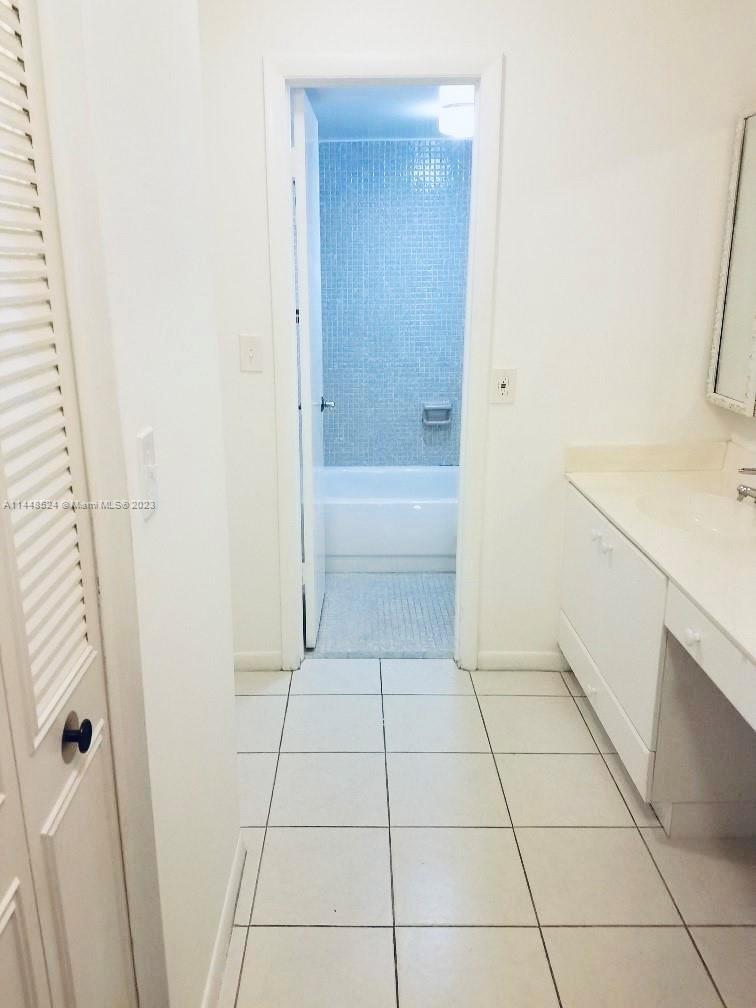 6801 Southwest 147th Avenue, Unit 1E2 Miami, FL 33193 - Photo 7 of 15 a bathroom with a sink and a shower