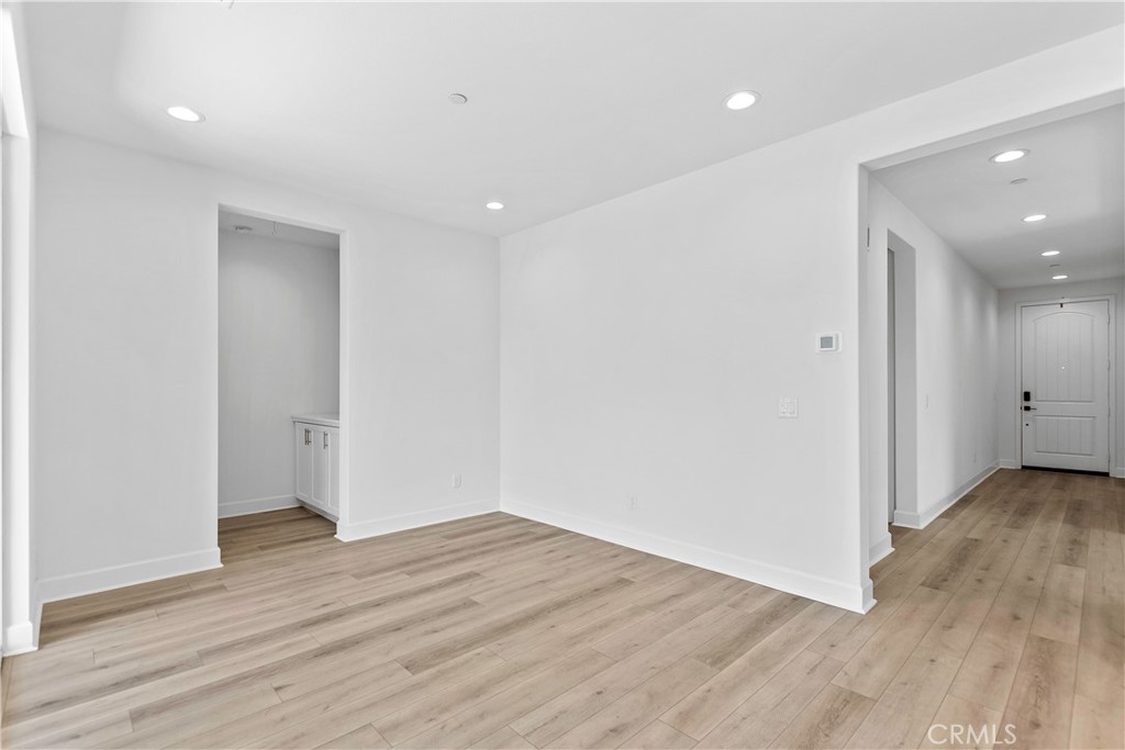 5024 Rexton Drive Camarillo, CA 93012 - Photo 15 of 48 a view of an empty room with wooden floor