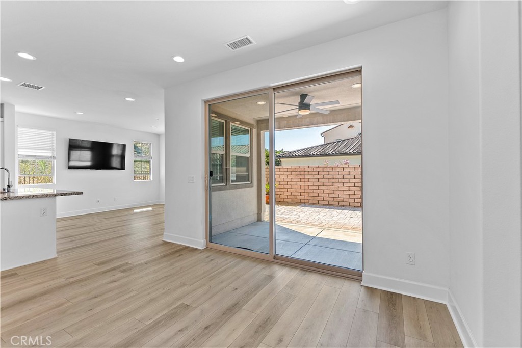 5024 Rexton Drive Camarillo, CA 93012 - Photo 16 of 48 a view of empty room with wooden floor and fan