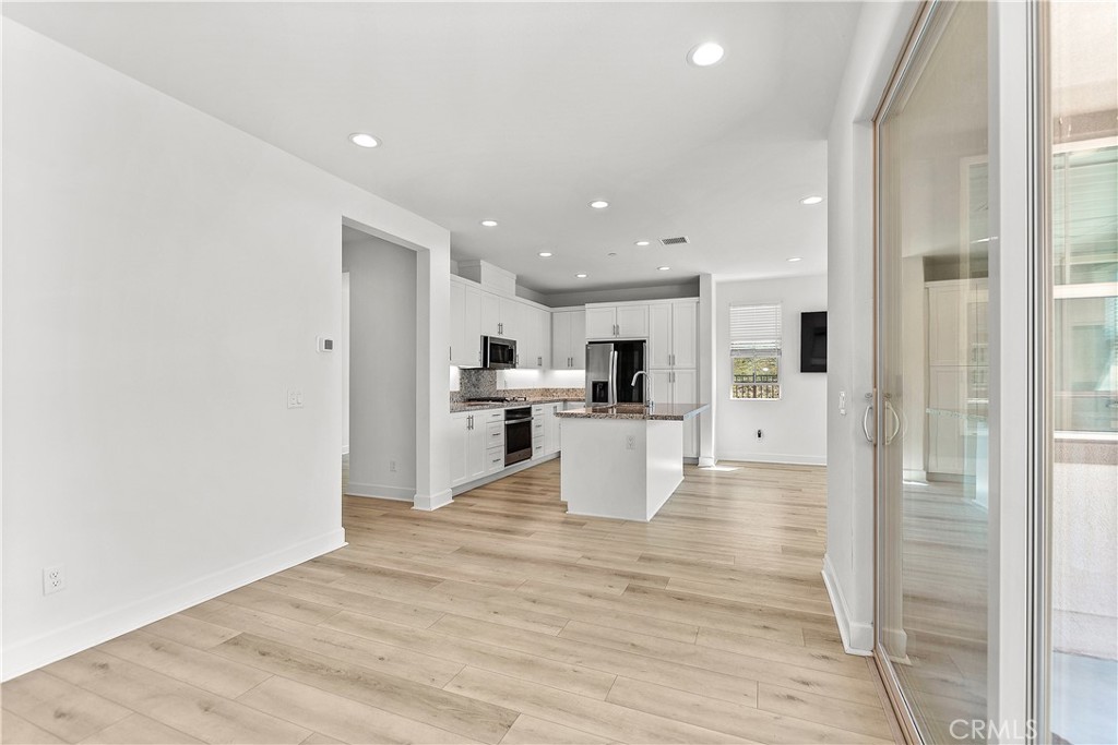 5024 Rexton Drive Camarillo, CA 93012 - Photo 17 of 48 a view of kitchen dining table and cabinets