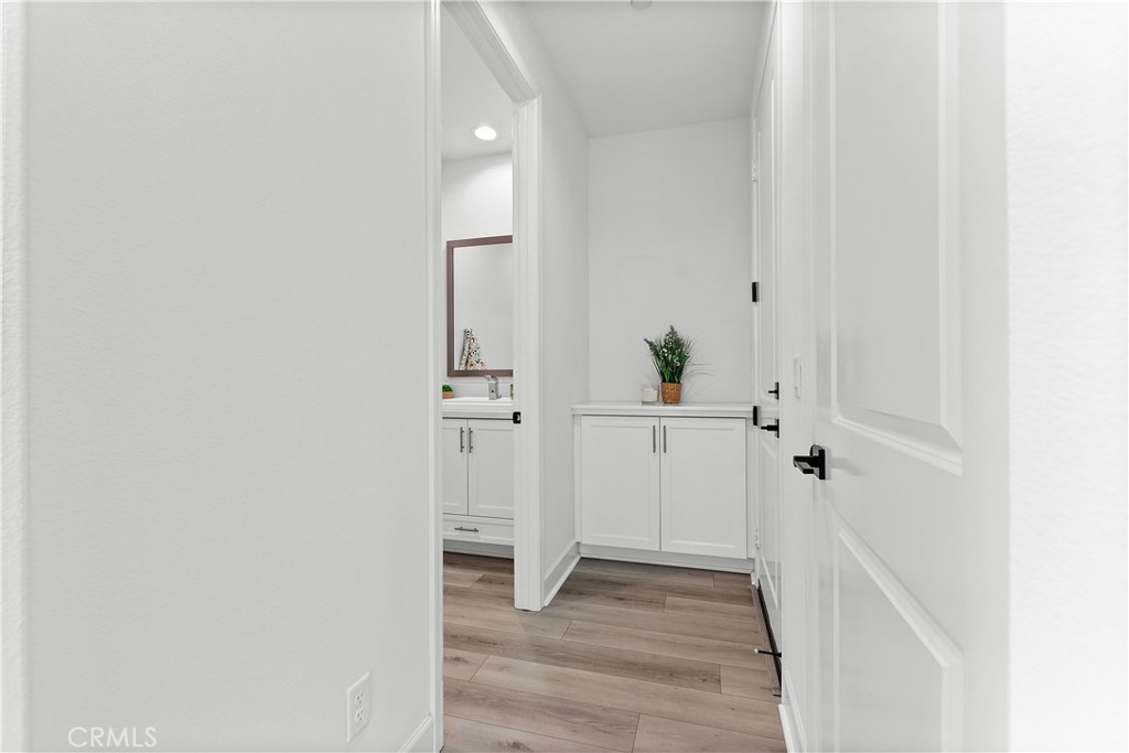 5024 Rexton Drive Camarillo, CA 93012 - Photo 24 of 48 a view of a hallway with wooden floor