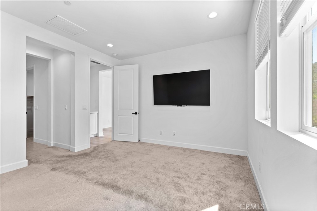 5024 Rexton Drive Camarillo, CA 93012 - Photo 27 of 48 a room with a flat screen tv and white walls