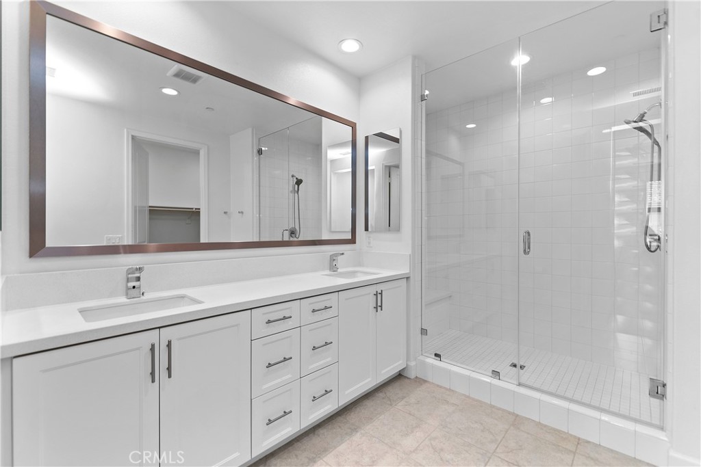 5024 Rexton Drive Camarillo, CA 93012 - Photo 28 of 48 a bathroom with double sink and a mirror