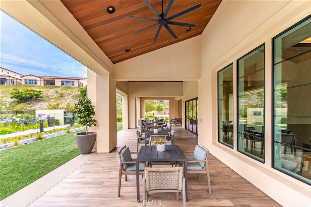 5024 Rexton Drive Camarillo, CA 93012 - Photo 38 of 48 a dining room with wooden floor and outdoor seating