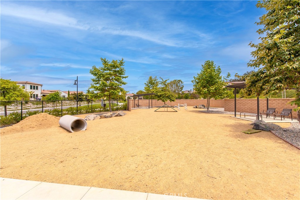 5024 Rexton Drive Camarillo, CA 93012 - Photo 45 of 48 a view of a swimming pool with an outdoor space and seating area