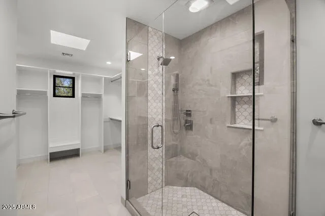 a bathroom with a shower and toilet