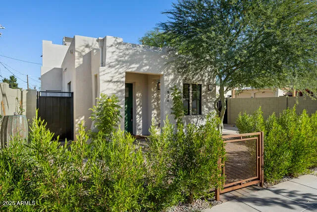 front view of a house with a tree