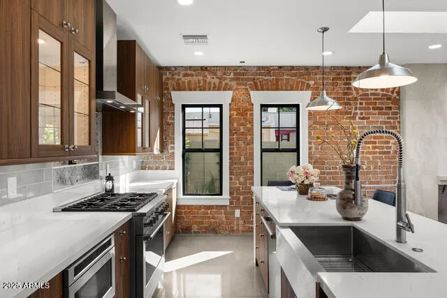 a kitchen with a sink stove and refrigerator
