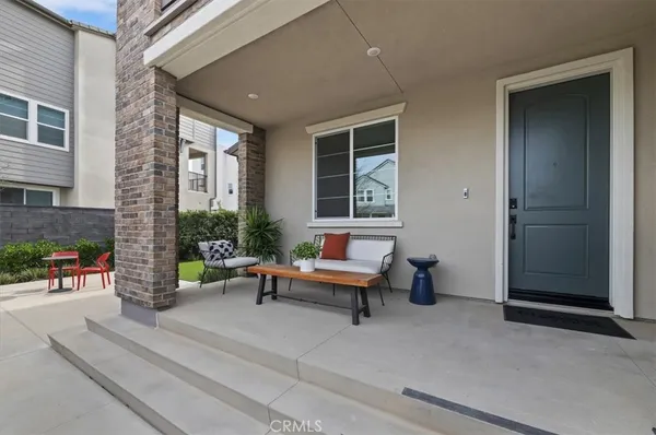 a backyard of a house with outdoor seating