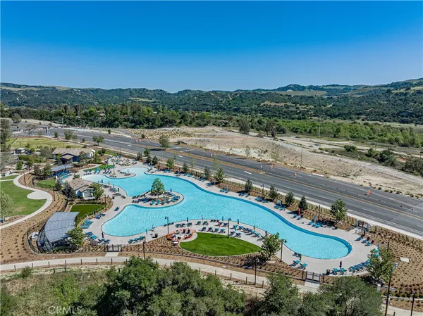 a view of a swimming pool with a patio
