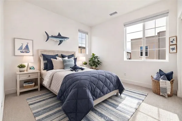 a living room with furniture and baby crib
