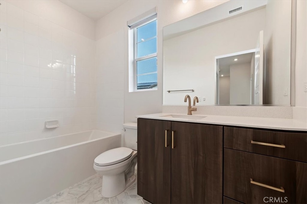 31680 Williams Way Rancho Mission Viejo, CA 92694 - Photo 10 of 35 a bathroom with a sink a toilet and a mirror