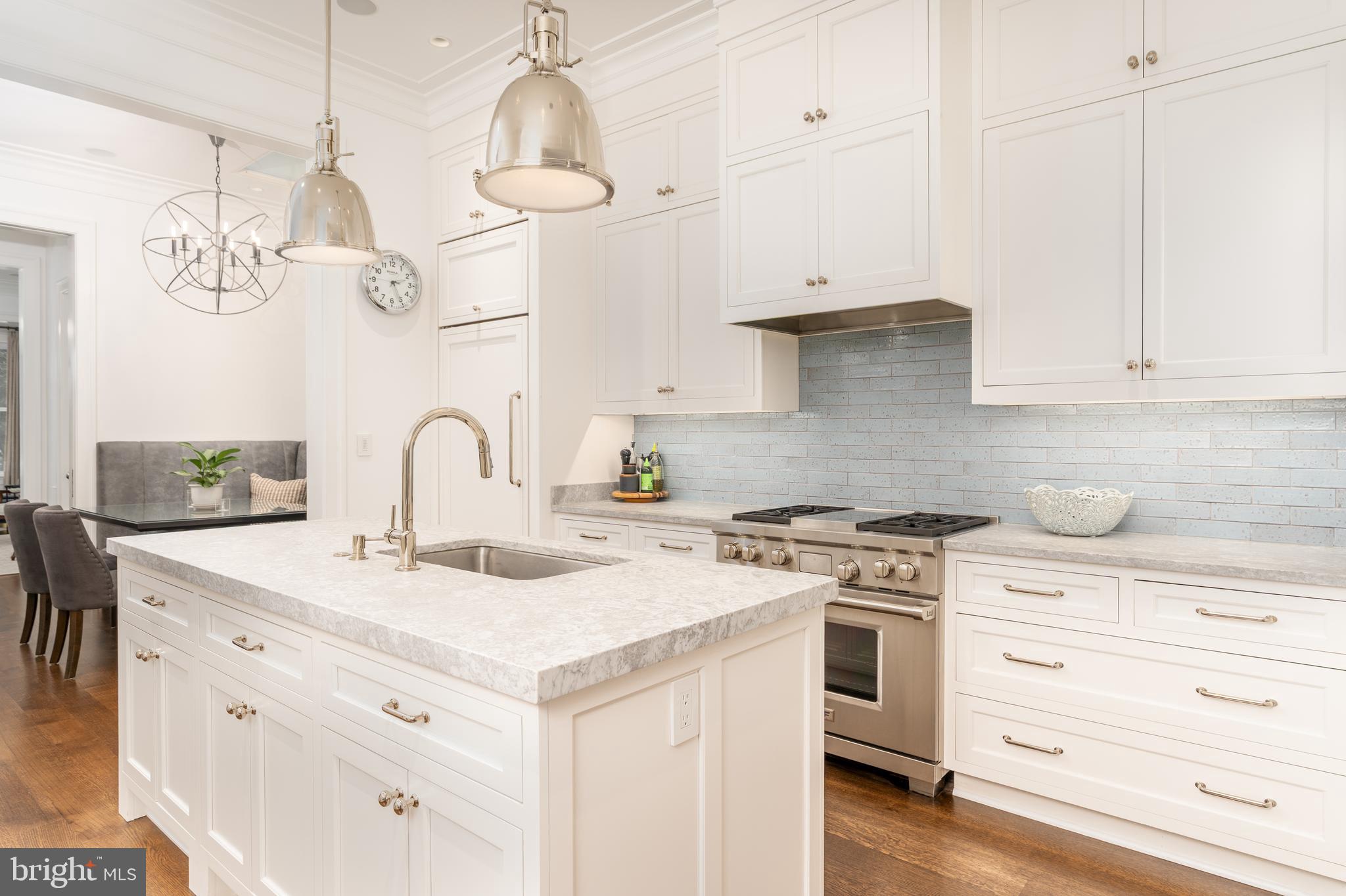 1619 19th Street Northwest Washington, DC 20009 - Photo 11 of 50 a kitchen with white cabinets and appliances