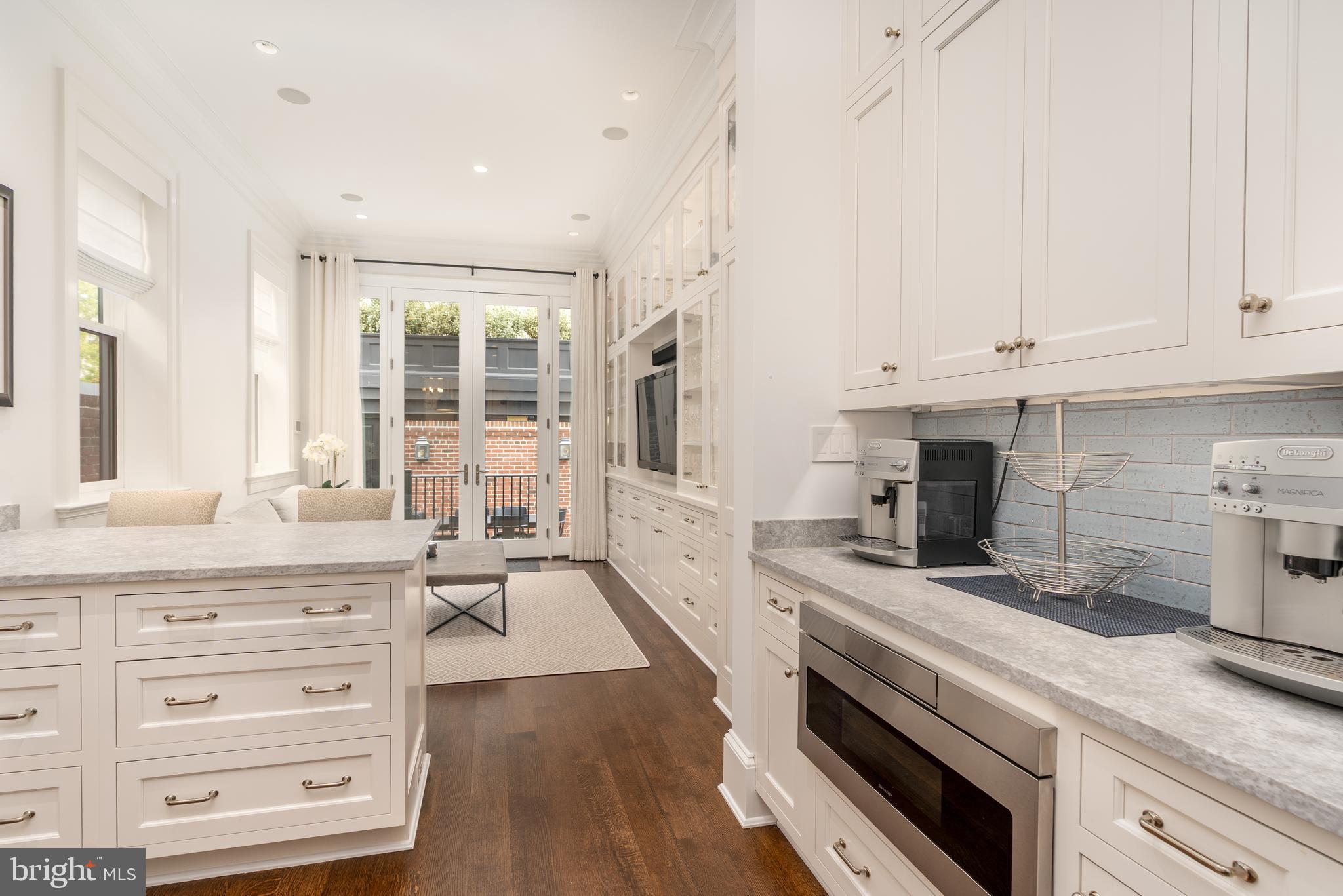 1619 19th Street Northwest Washington, DC 20009 - Photo 13 of 50 a kitchen with granite countertop a stove and a sink