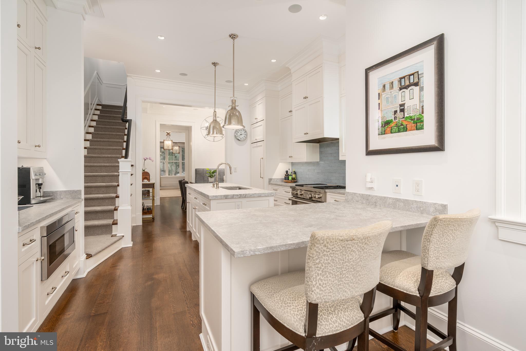 1619 19th Street Northwest Washington, DC 20009 - Photo 14 of 50 a large kitchen with a table and chairs