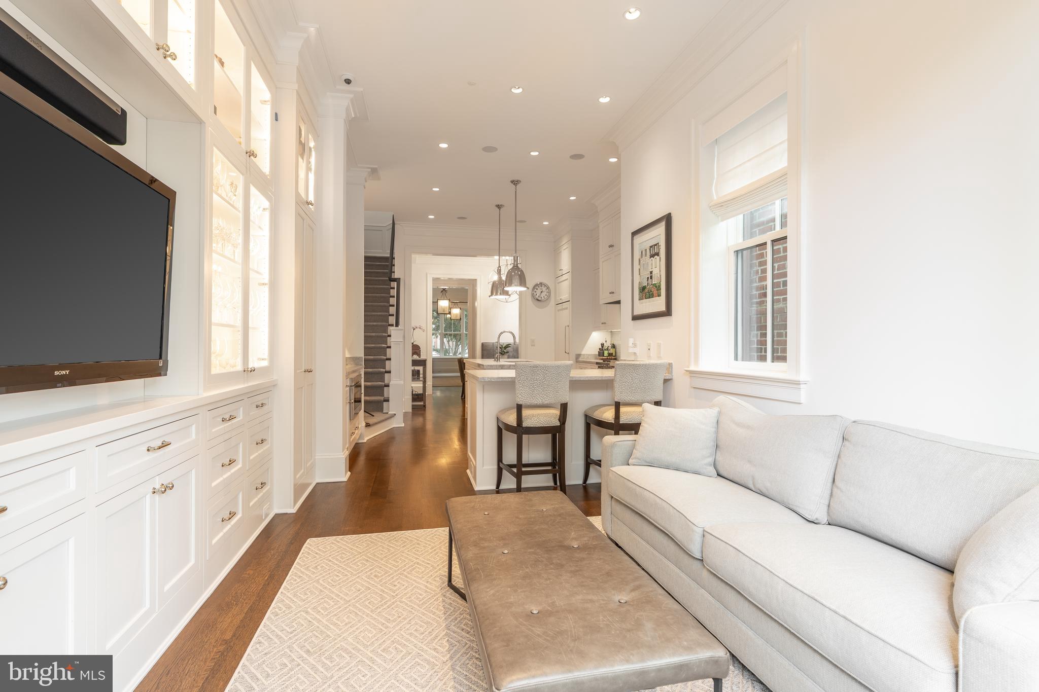 1619 19th Street Northwest Washington, DC 20009 - Photo 15 of 50 a living room with furniture and a flat screen tv