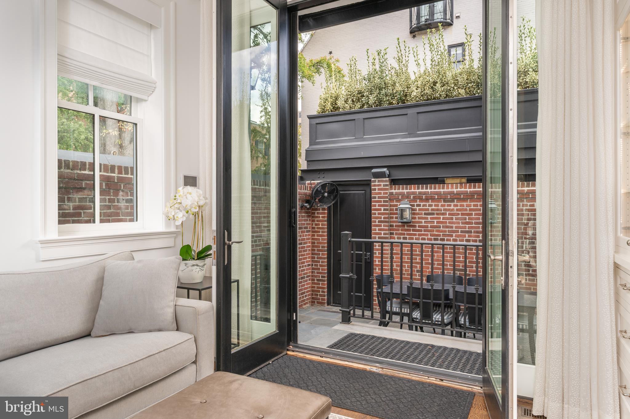 1619 19th Street Northwest Washington, DC 20009 - Photo 17 of 50 a living room with furniture and a window