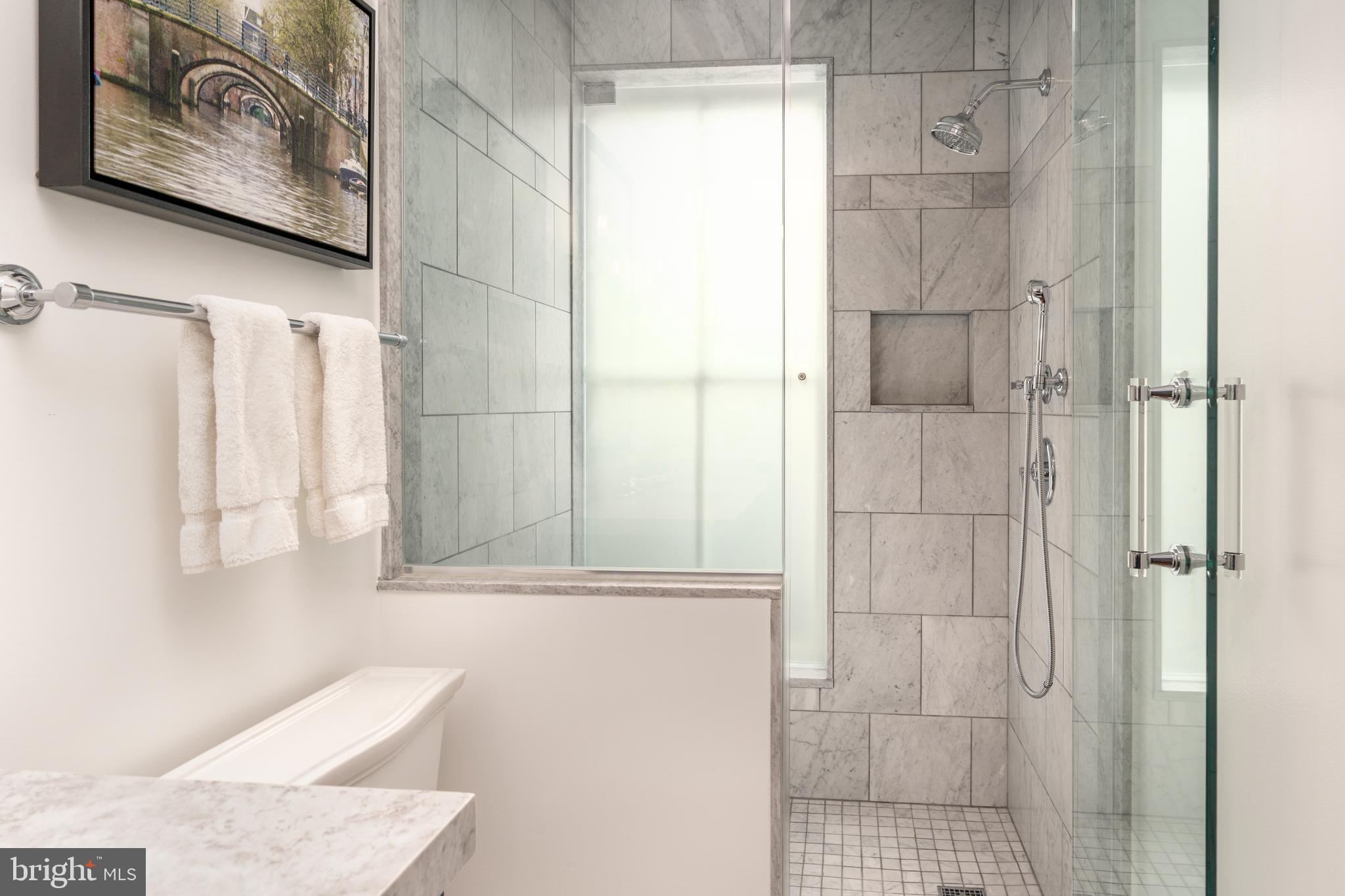 1619 19th Street Northwest Washington, DC 20009 - Photo 26 of 50 a bathroom with a bathtub and shower