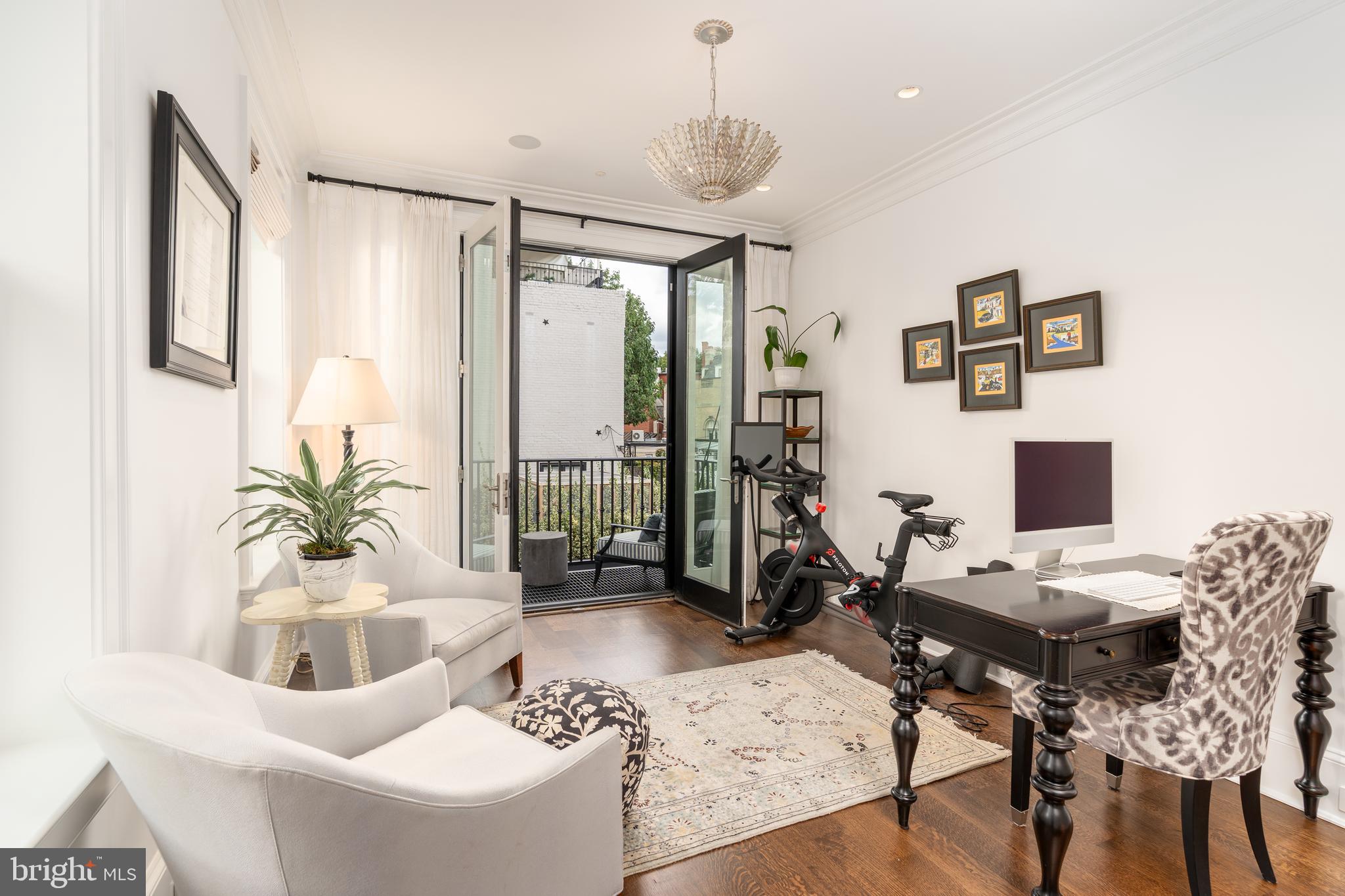 1619 19th Street Northwest Washington, DC 20009 - Photo 30 of 50 a work room with furniture and a potted plant