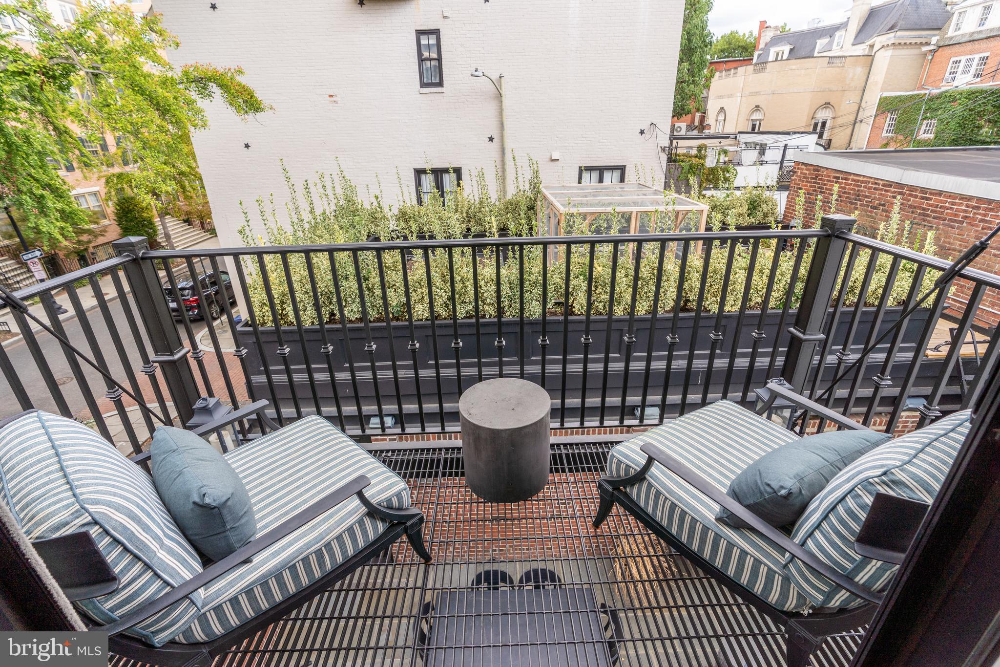 1619 19th Street Northwest Washington, DC 20009 - Photo 31 of 50 a view of a chairs and table on the deck