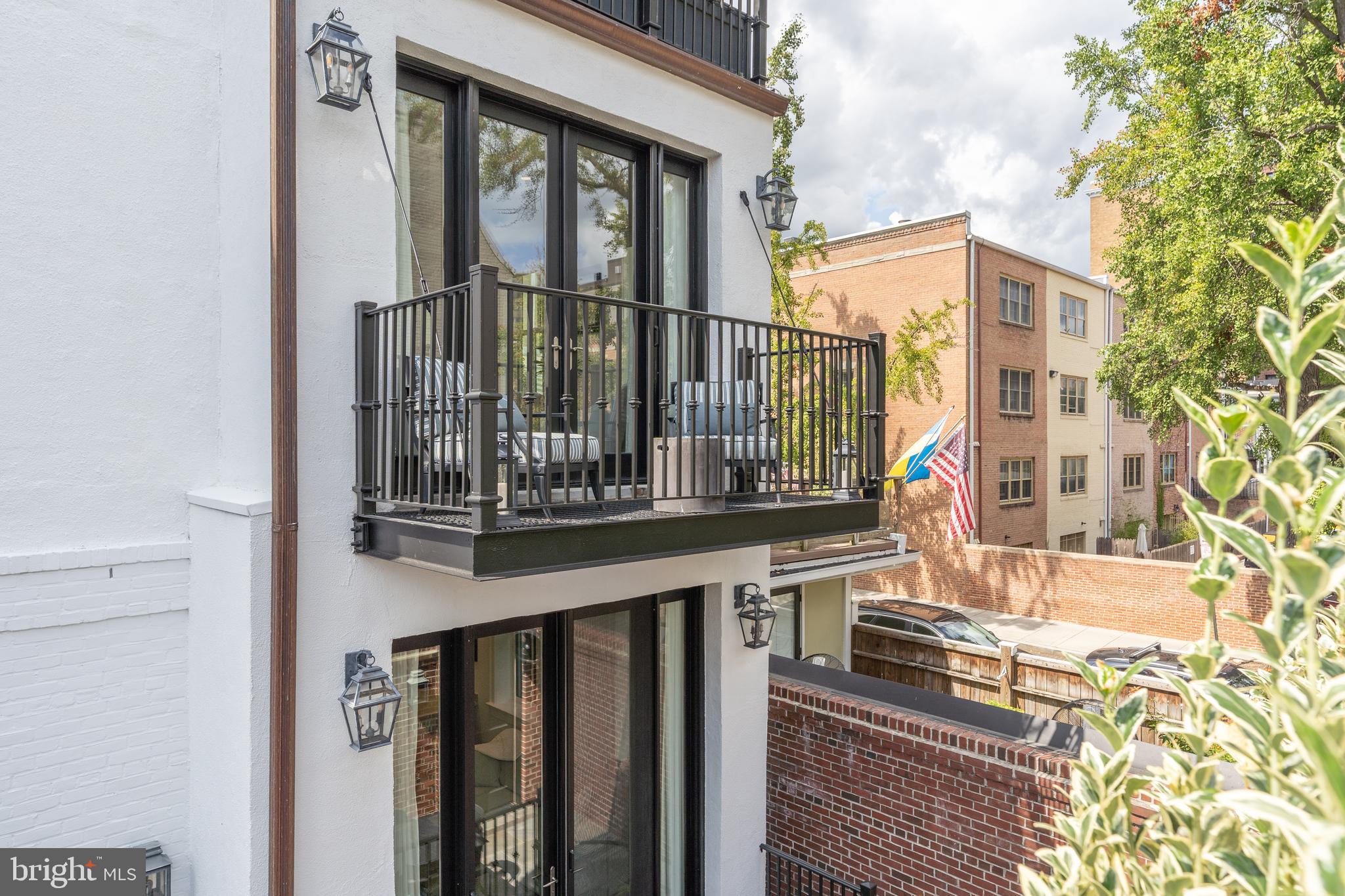 1619 19th Street Northwest Washington, DC 20009 - Photo 32 of 50 a view of a brick house with a small yard