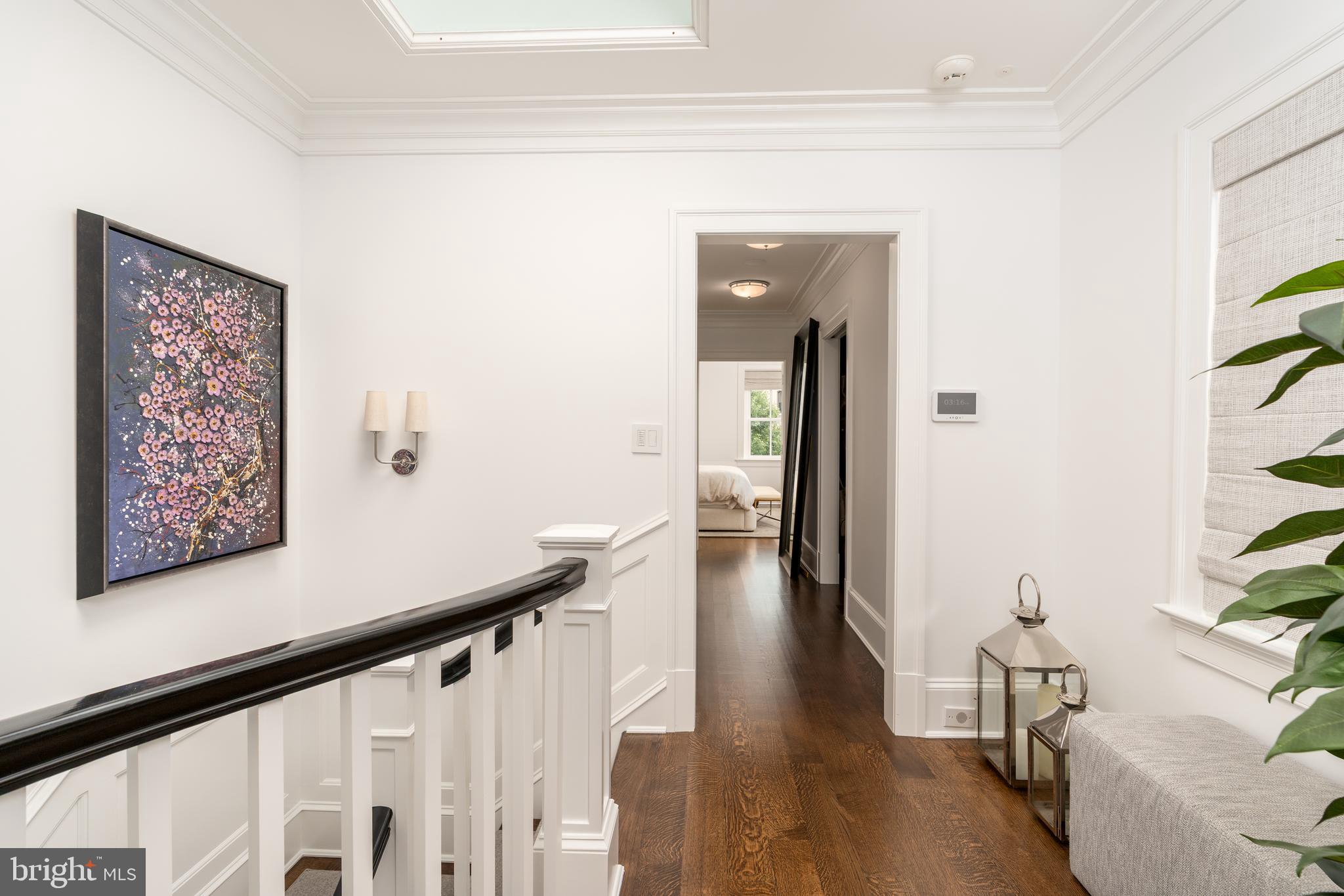 1619 19th Street Northwest Washington, DC 20009 - Photo 34 of 50 a view of a hallway with wooden floor and furniture