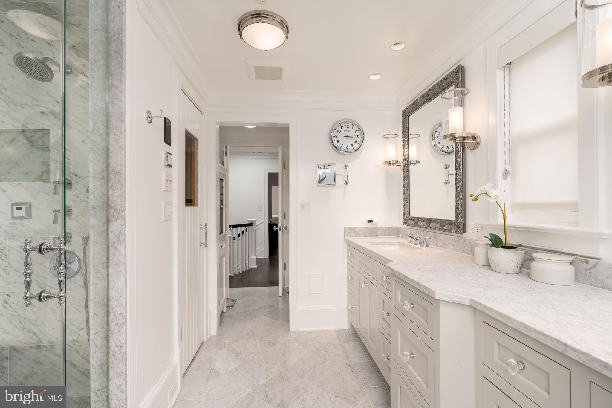1619 19th Street Northwest Washington, DC 20009 - Photo 38 of 50 a spacious bathroom with a double vanity sink mirror and shower