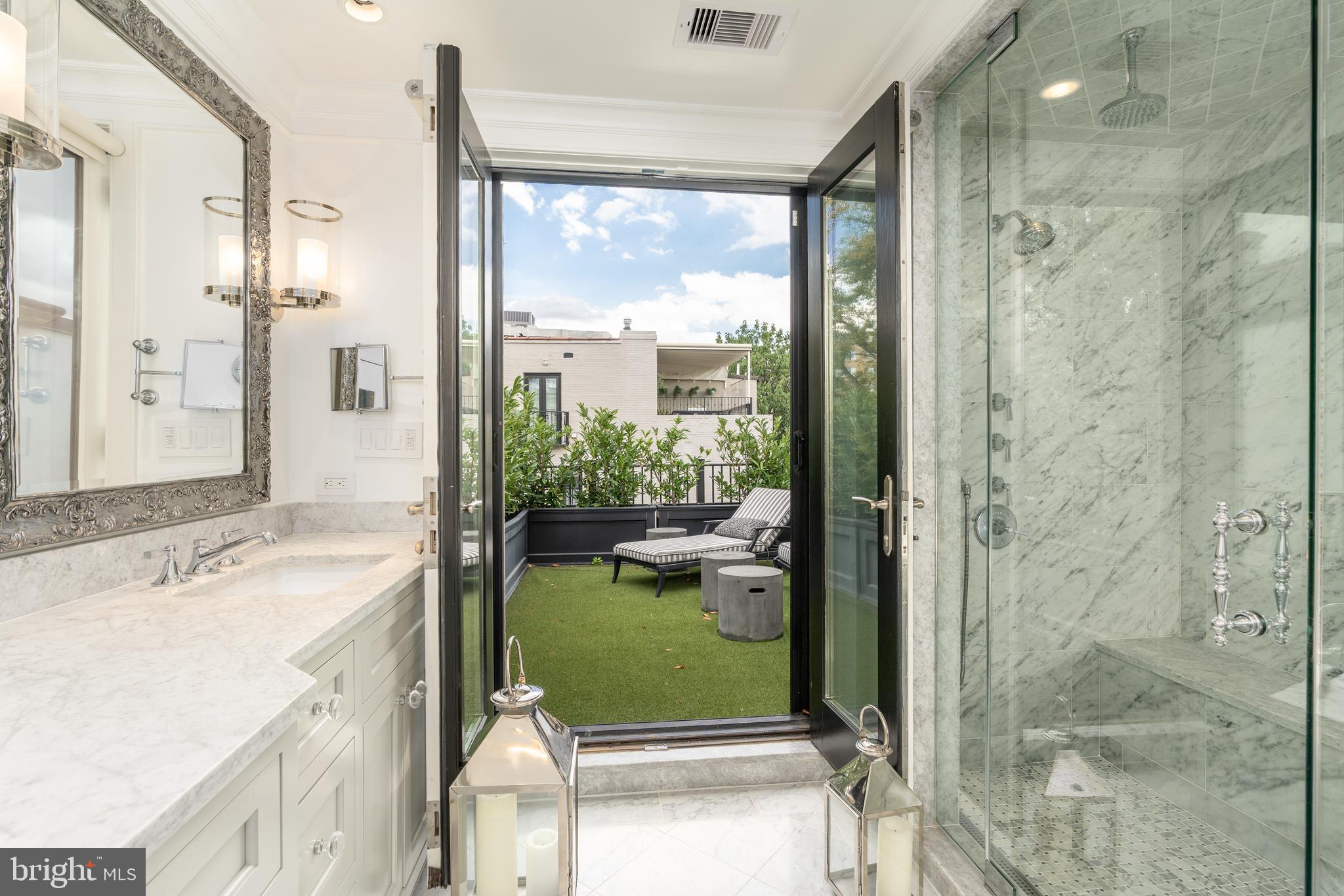 1619 19th Street Northwest Washington, DC 20009 - Photo 40 of 50 a bathroom with a sink a toilet and shower