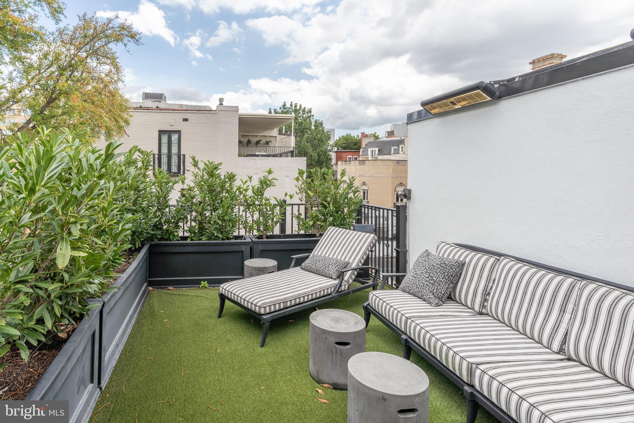 1619 19th Street Northwest Washington, DC 20009 - Photo 41 of 50 a balcony with furniture and a garden