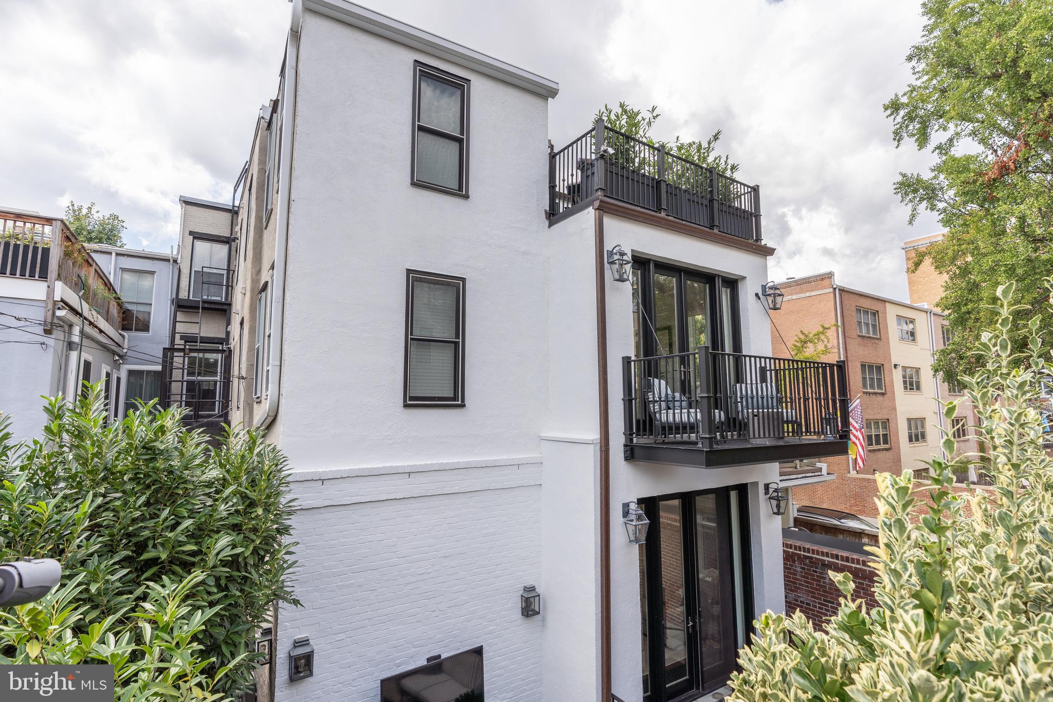 1619 19th Street Northwest Washington, DC 20009 - Photo 42 of 50 a front view of a house with a garden