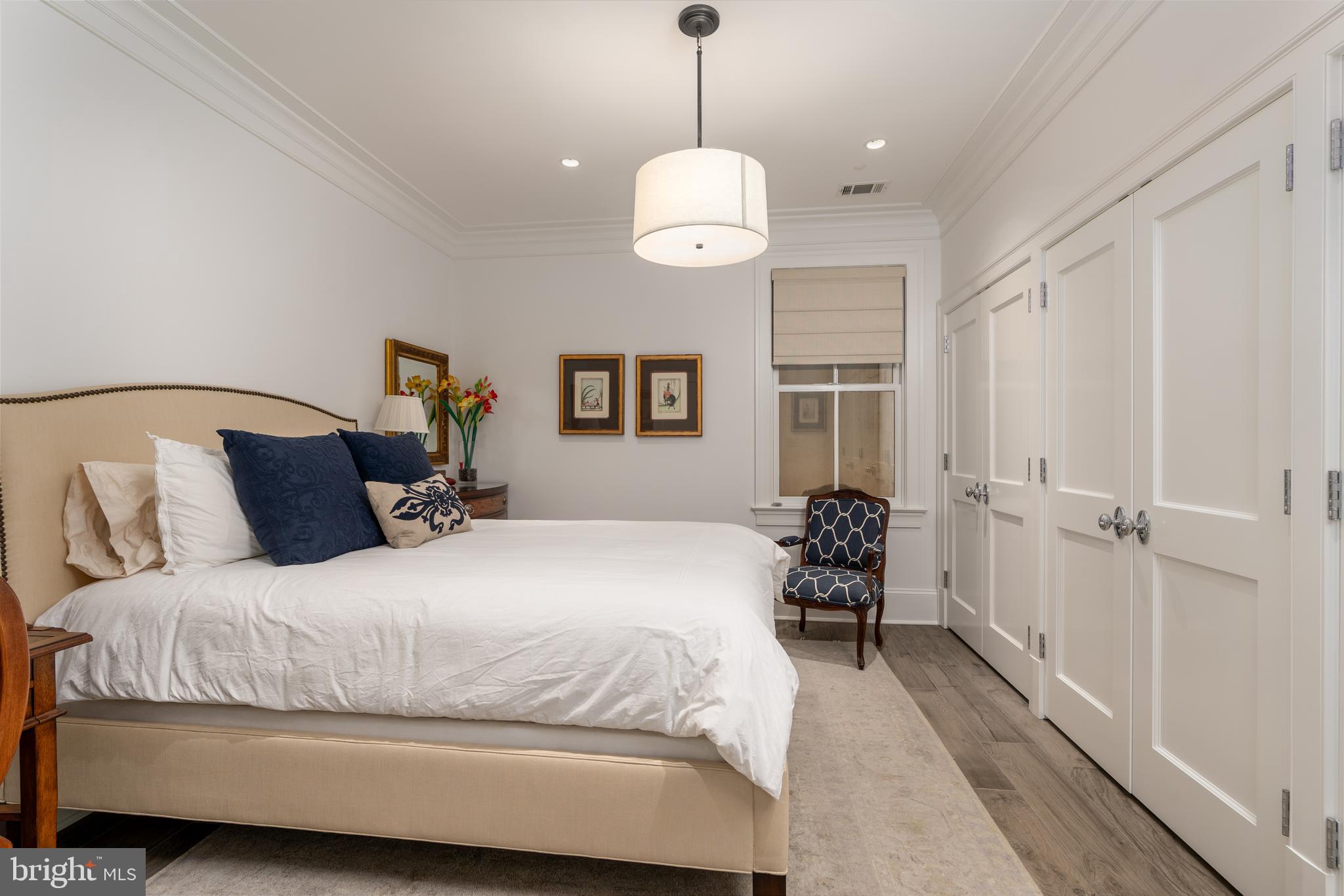 1619 19th Street Northwest Washington, DC 20009 - Photo 45 of 50 a bedroom with a bed and window